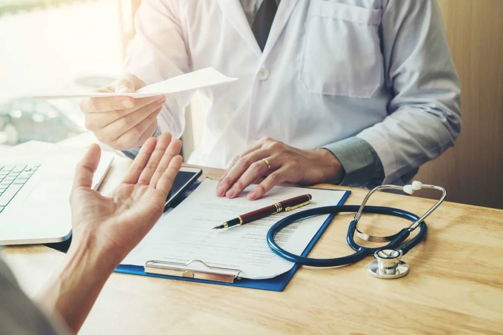 Doctor giving patient prescription medicare