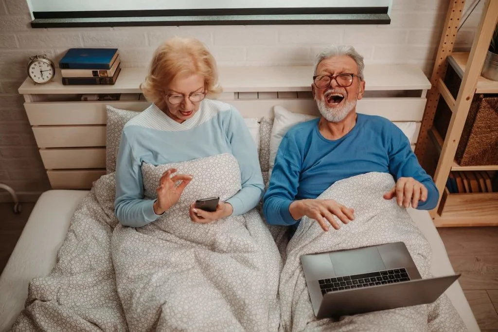 top view of senior couple in bed