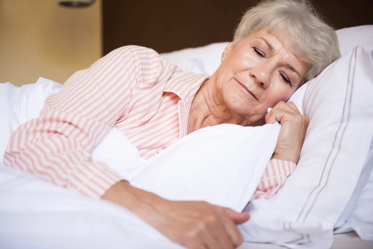 tired senior woman in the bed