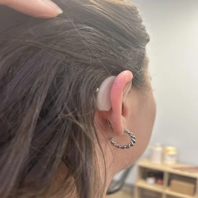 Audien Ion Pro hearing aid in a woman’s ear
