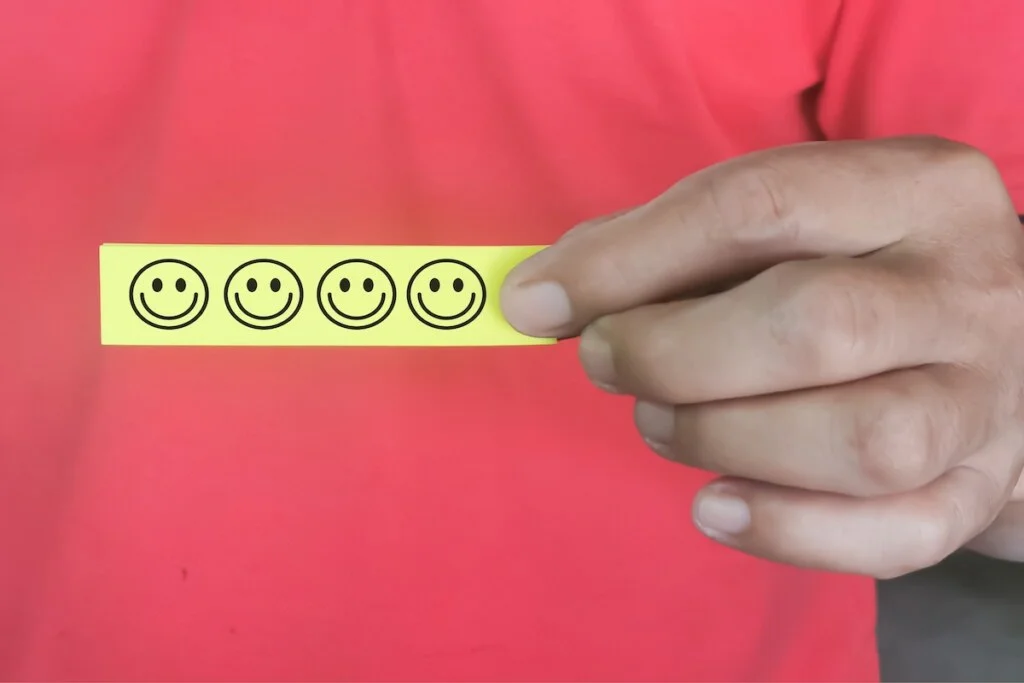 selective focus sticky note with smiley face symbol