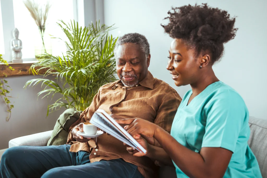An older man and a younger woman talking