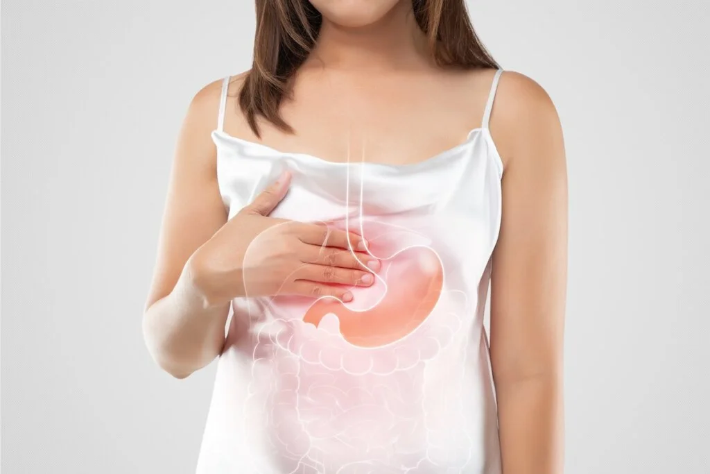 woman suffering from gastroesophageal reflux acid