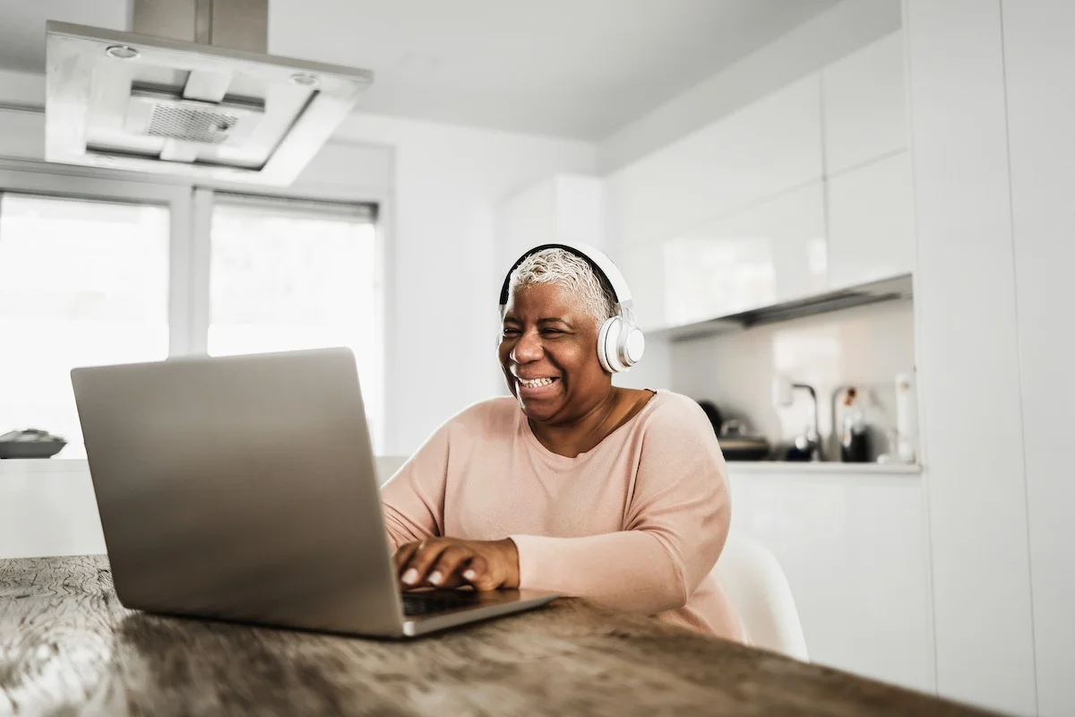 senior african woman using laptop computer