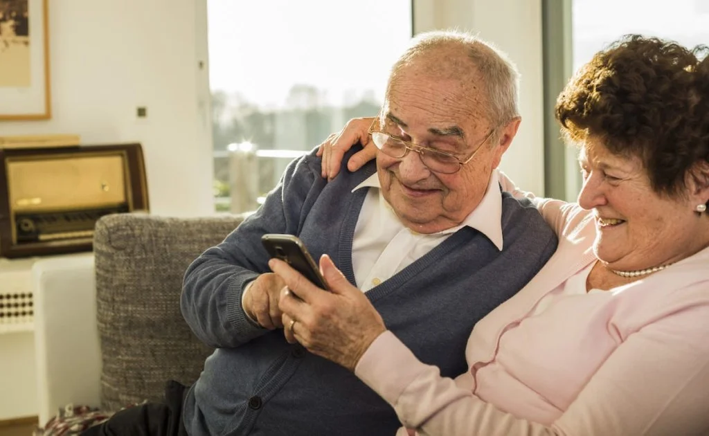 Senior couple using smartphone