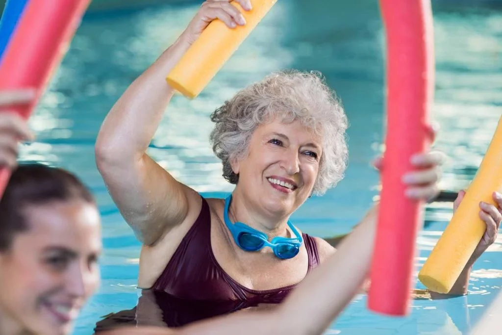 senior woman doing water aerobics