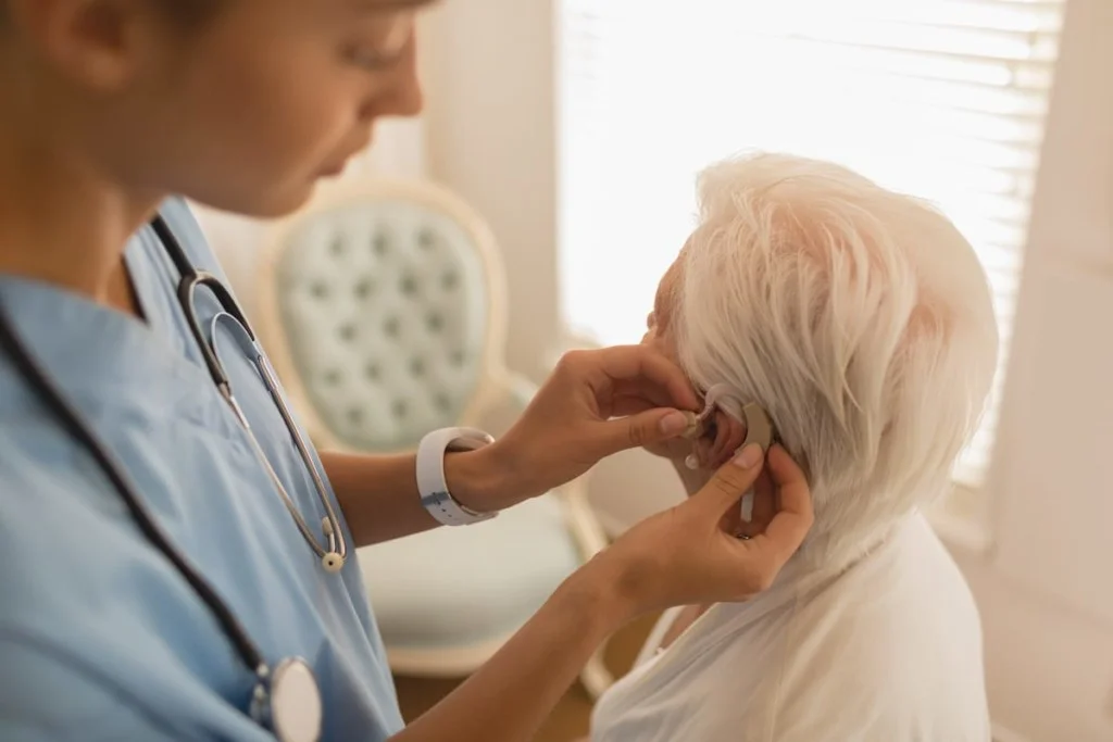 female physician caring for senior woman