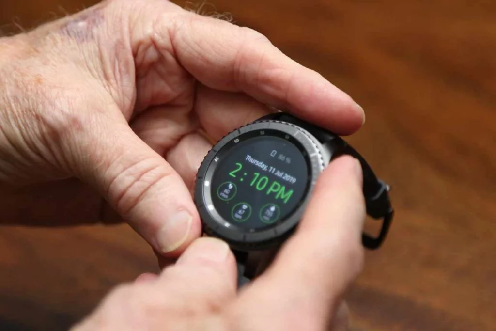 Senior Man using MobileHelp Smart Watch Menu
